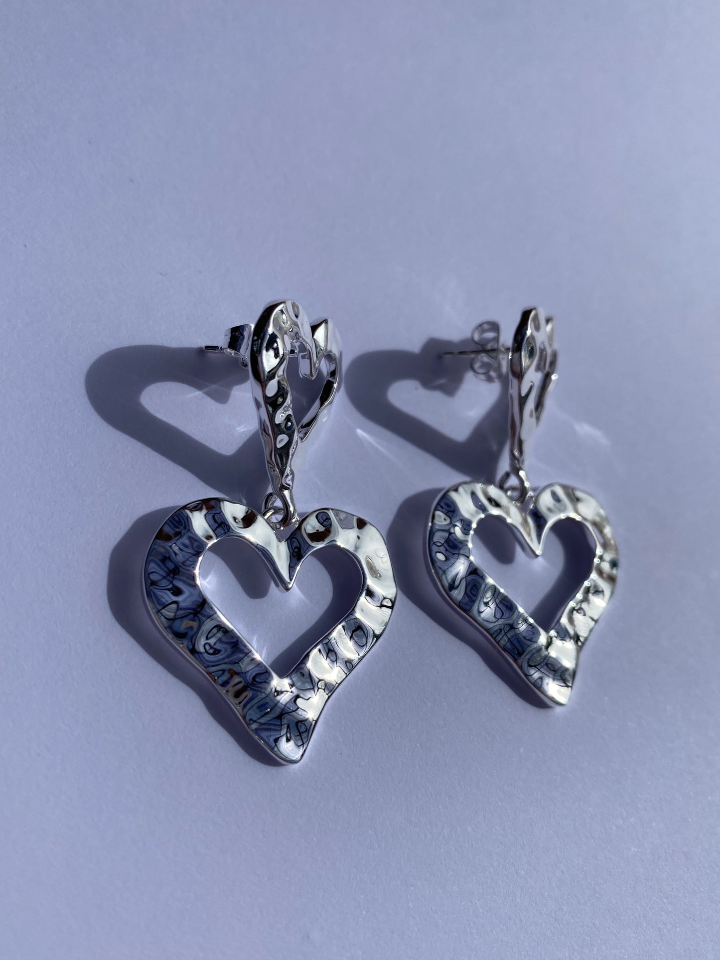 Ada's heart drop earrings in silver plating