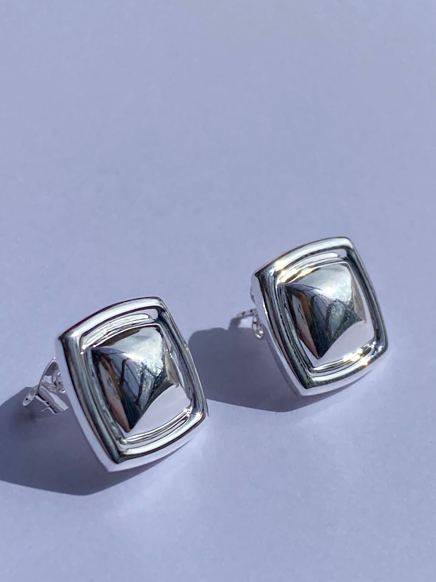 Rosie's bold stud earrings in silver plating