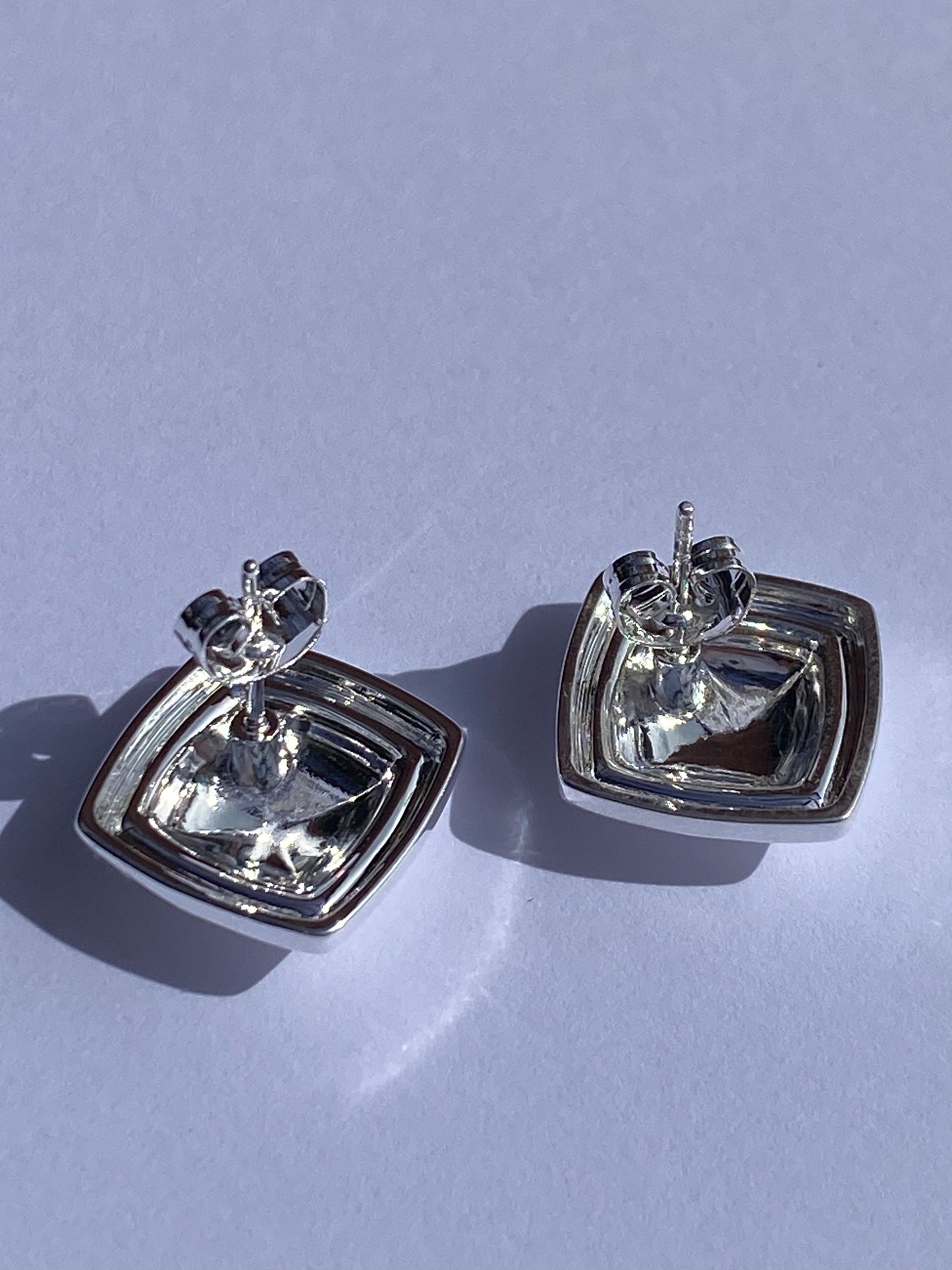 Rosie's bold stud earrings in silver plating